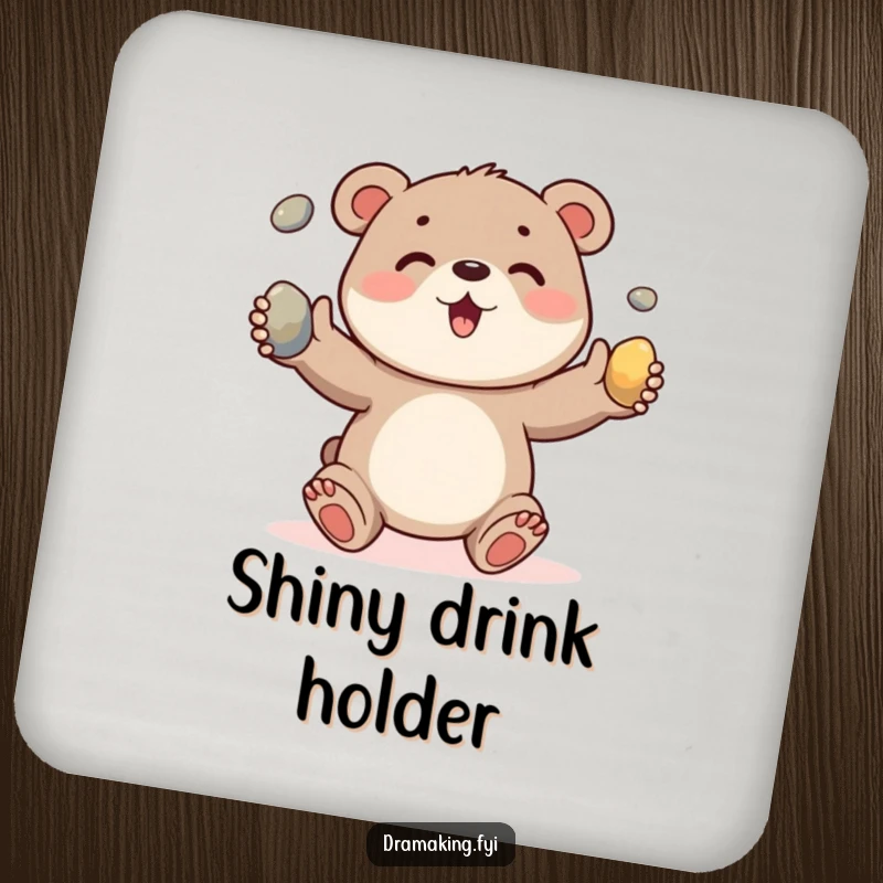 Funny drink coaster featuring a happy bear cub excitedly juggling three shiny pebbles, adding cute and humorous decor.