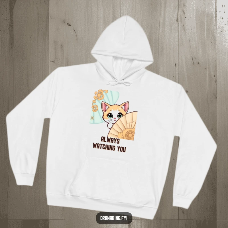 Funny hoodie with a wide-eyed cat peeking from behind a grand, decorative fan, offering warmth and a touch of mystery.