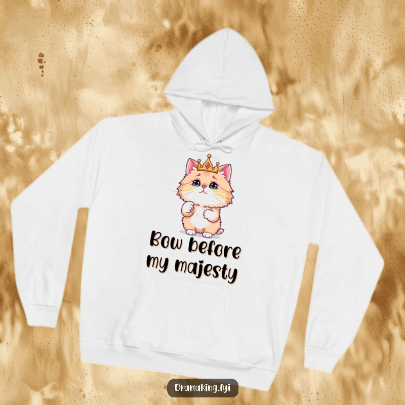 Funny hoodie featuring a fluffy cat with a crown, pointing dramatically at a small sparkling item, conveying feline superiority.