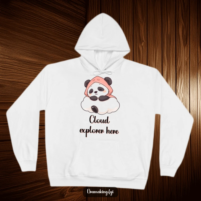 Funny hoodie featuring a panda in a tiny cape napping peacefully on a cloud, ideal for cozy days and sweet dreams.