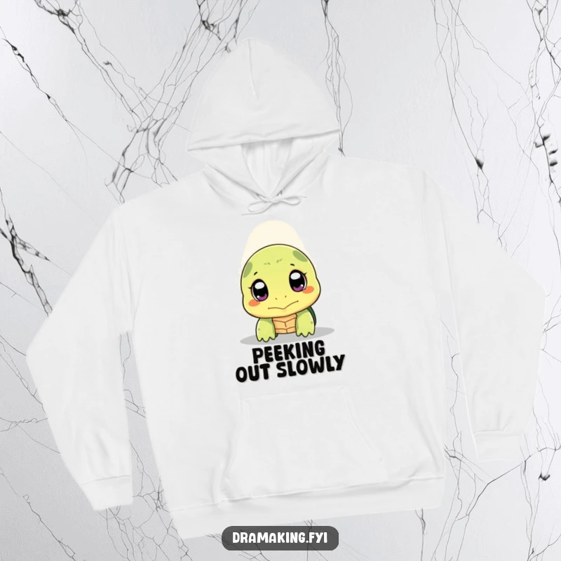 Funny shy turtle hoodie featuring a turtle peeking its head out with wide, expressive eyes under a spotlight, soft and warm.