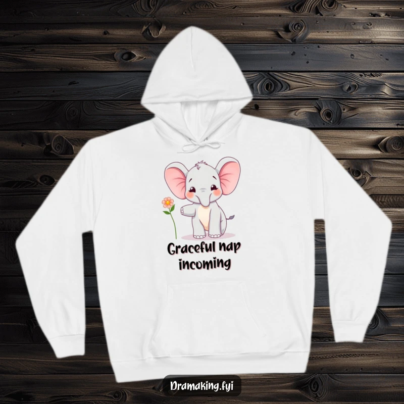 Funny Elephant Calf Balancing Hoodie: A joyful elephant calf balances precariously with a flower, a heartwarming and funny gift.