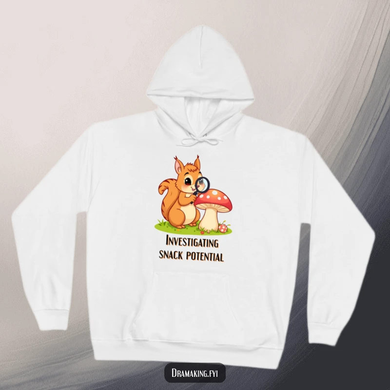 Funny hoodie shows a curious squirrel with a magnifying glass examining a large, colorful mushroom, offering cozy nature humor.