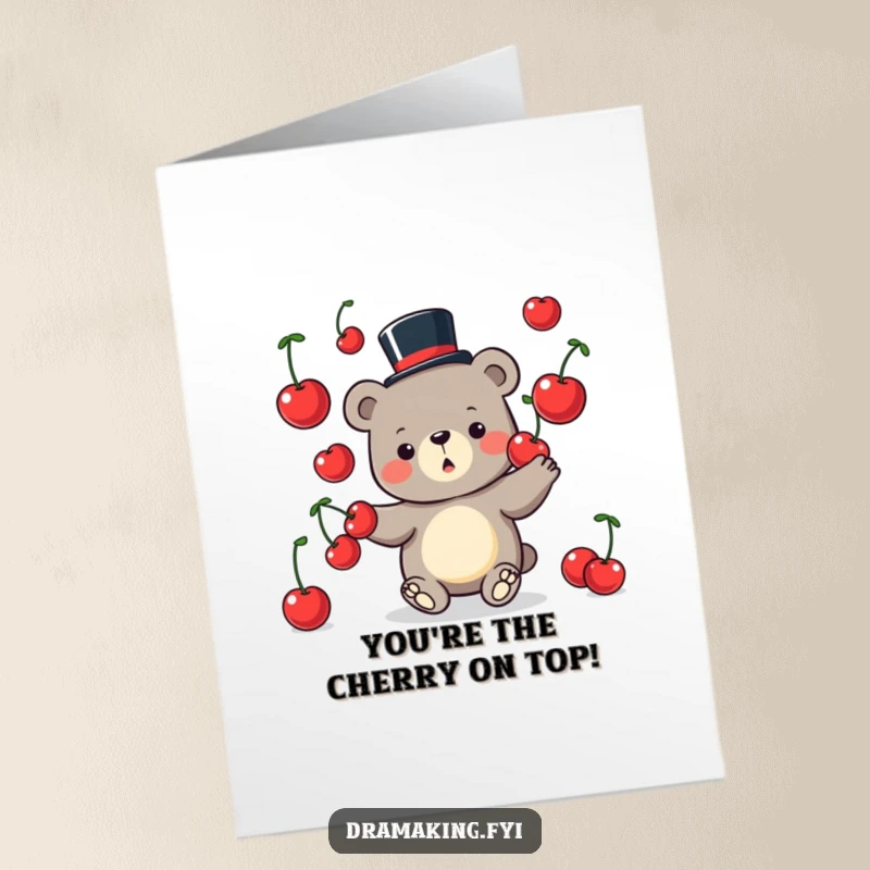 Free printable congratulations card: a charming bear wearing a small top hat, juggling oversized cherries with impressive skill.