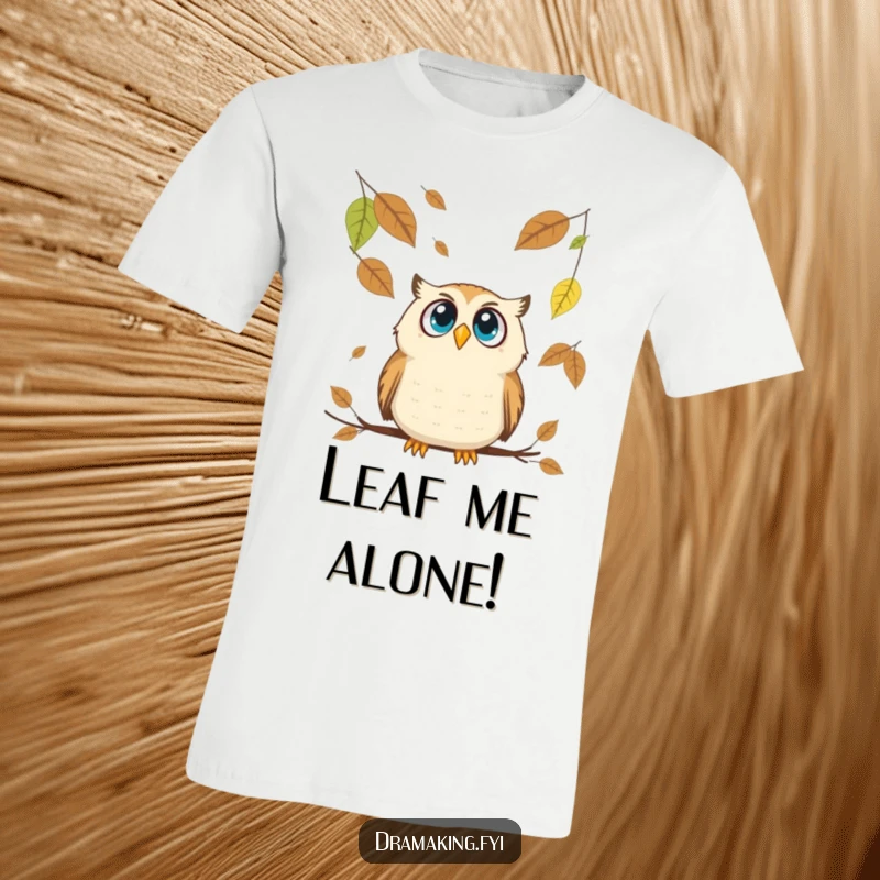 Funny Owl T-Shirt: A wide-eyed owl looks up in comical surprise as giant leaves descend from the sky.