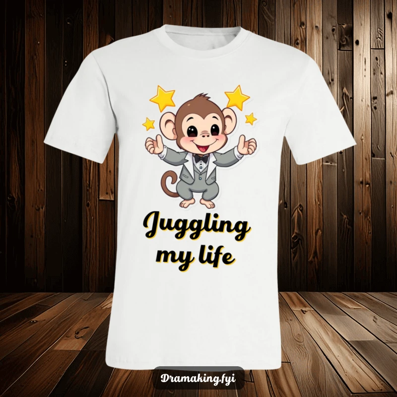 Funny t-shirt depicting a monkey in a sharp tuxedo expertly juggling bright shining stars, showcasing playful cosmic talent.